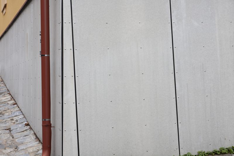 Worker Installing Cladding in Dry Conditions